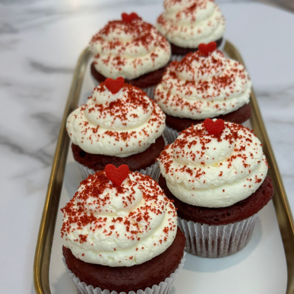 Savor the rich, velvety texture and subtle cocoa flavor of this iconic cupcake, topped with a smooth cream cheese frosting.